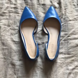 Bright blue Nine West flats with small heel.